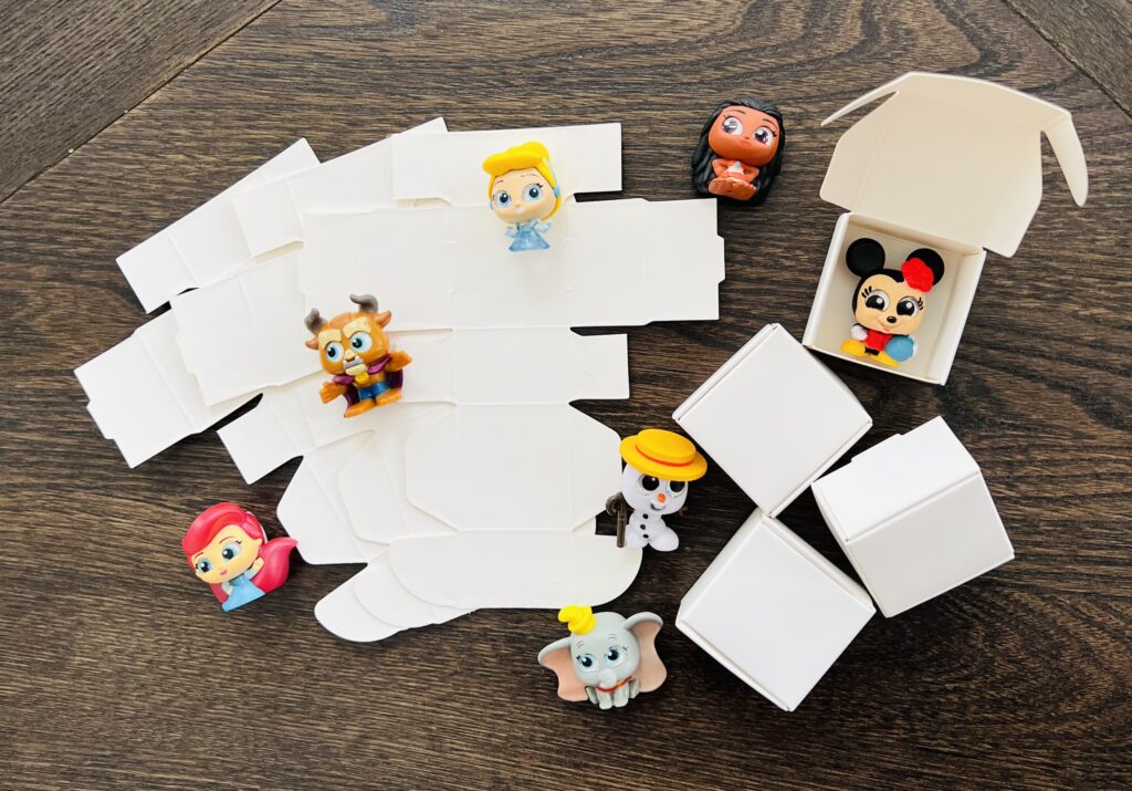 Assortment of Disney Doorables with the white boxes used for the countdown