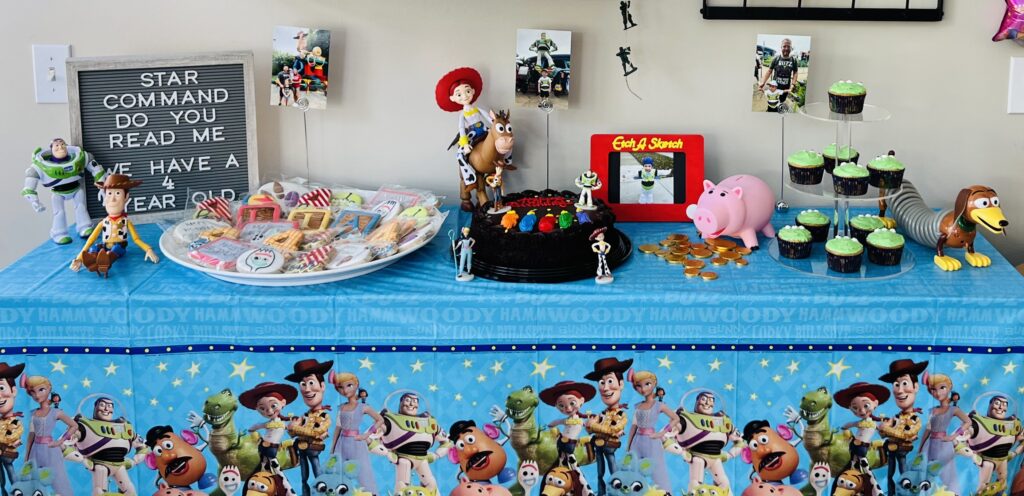 Toy Story birthday party treat table displaying various treats and decorations