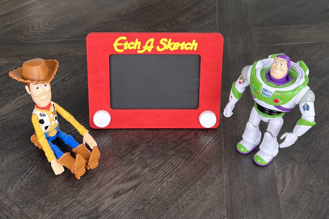 DIY Etch A Sketch photo frame with Woody and Buzz Toy Story toys